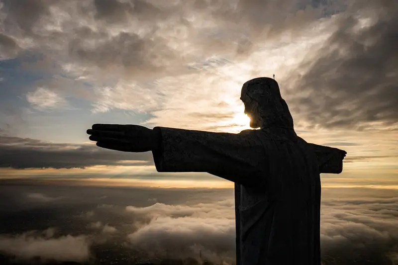 Silhouette of Cristo Rey at sunset